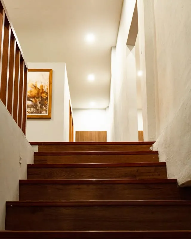 Elegant wooden stairway leading to treatment rooms at MY SPA LOMBOK Kuta